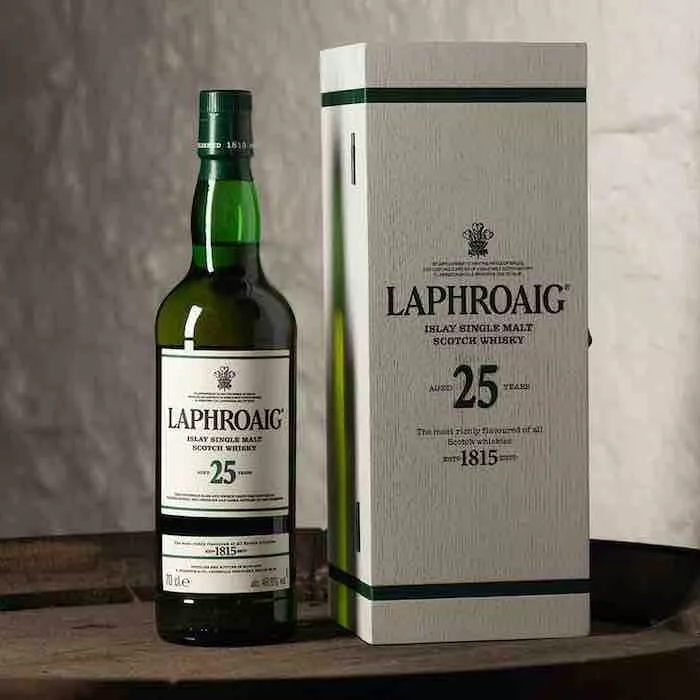 Laphroaig 25 year old Cask Strength 2020 whisky and gift box on wooden table