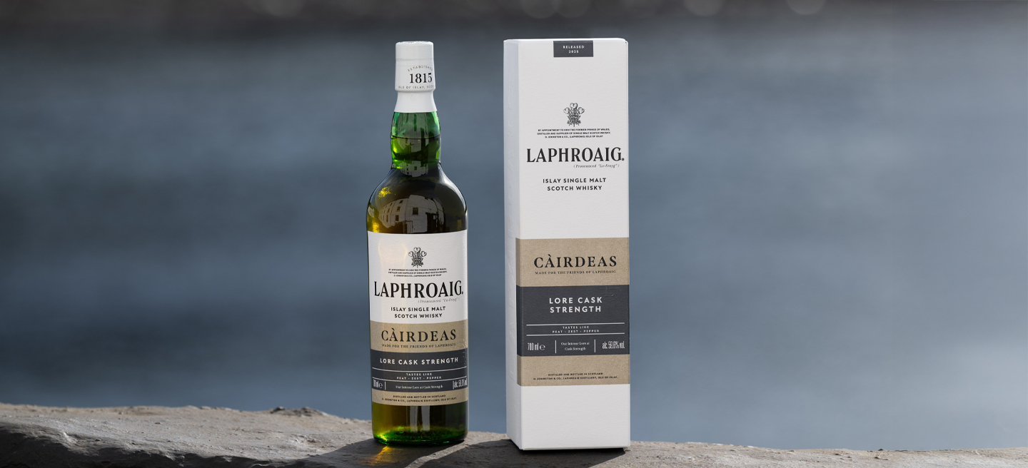 Lore Cairdeas 2025 bottle and box on distillery wall
