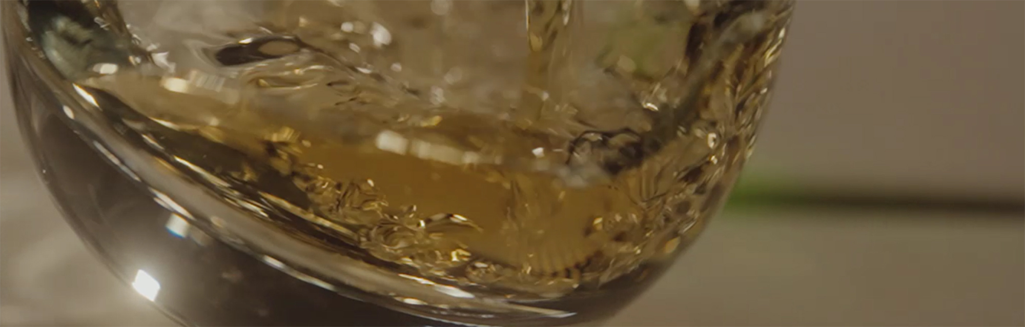 Whisky Liquid Swirling Glass Close Up Warm Tones Laphroaig