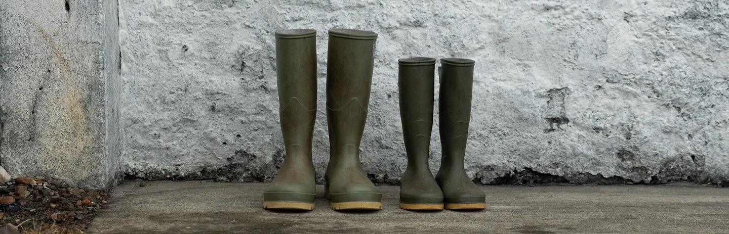 Distillery Rubber Boots Pair Concrete Floor White Wall Laphroaig