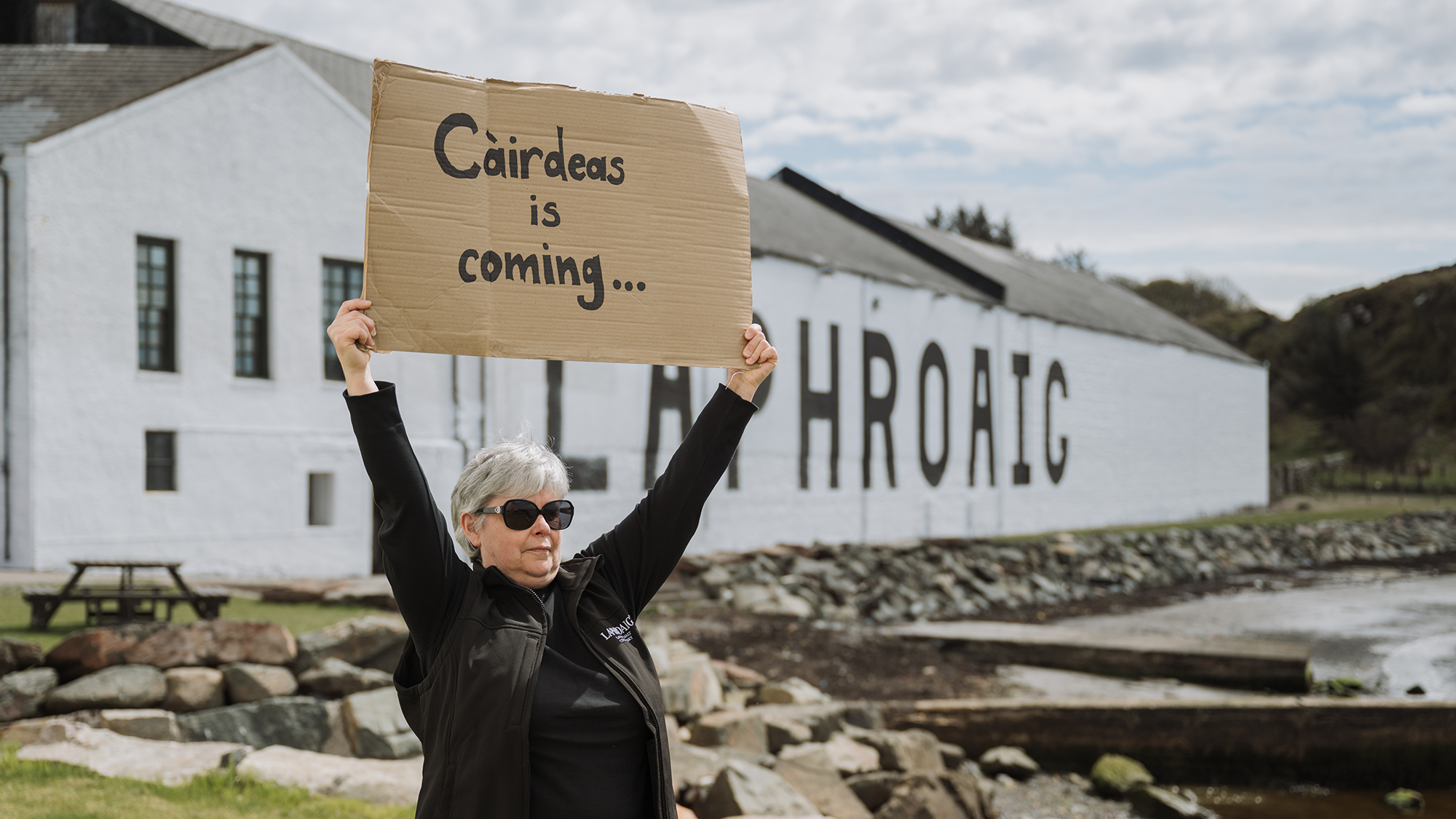 Susan with a Sign 16_9