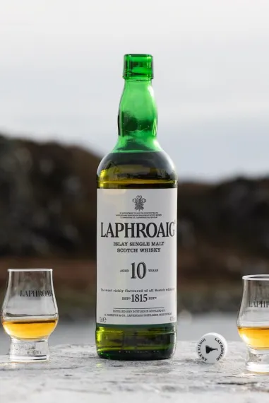 A bottle of Laphroaig whisky and two drams