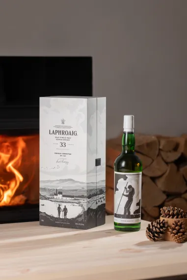 Strong Characters bottle and box in a festive setting