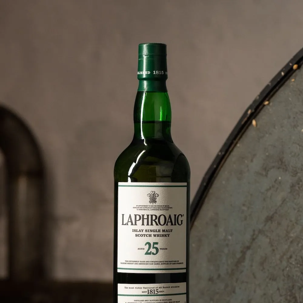 Laphroaig 25 year old single malt whisky against softened stone background