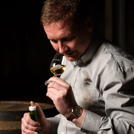 Barry MacAffer nosing a dram of Laphroaig