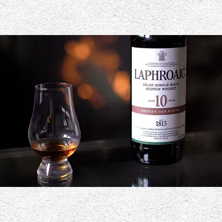 A bottle and a glass of Laphroaig scotch