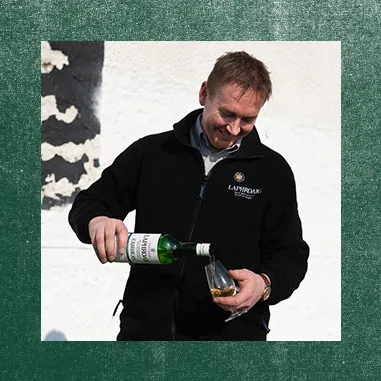 Distillery Manager Barry MacAffer pouring Laphroaig in a glass