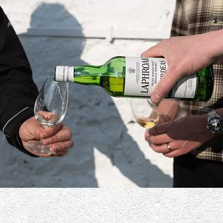 Pouring Laphroaig Islay single malt scotch whisky