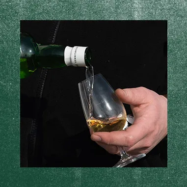 Pouring Laphroaig scotch in a glass
