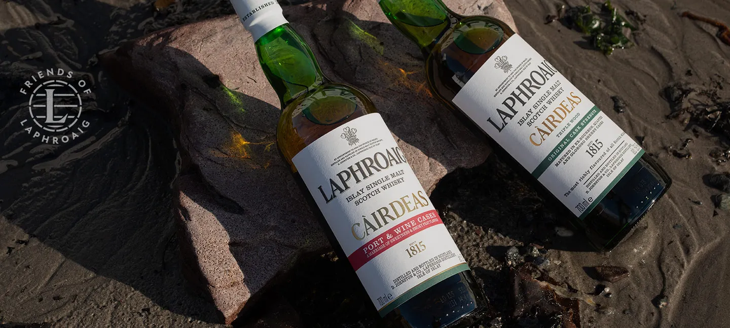 Laphroaig whisky Cairdeas bottles on beach