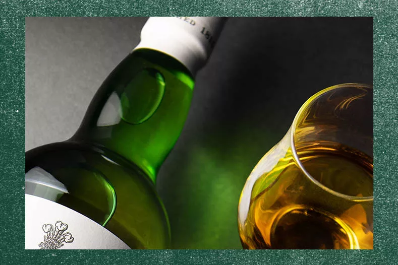 Detailed view of a dram and a bottle of Laphroaig Islay single malt scotch whisky 