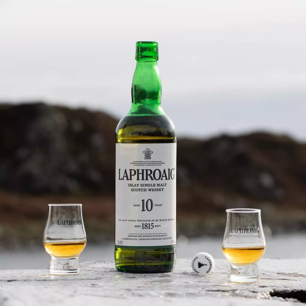 Laphroaig 10 bottle with two glasses of 10 year malt whiskey