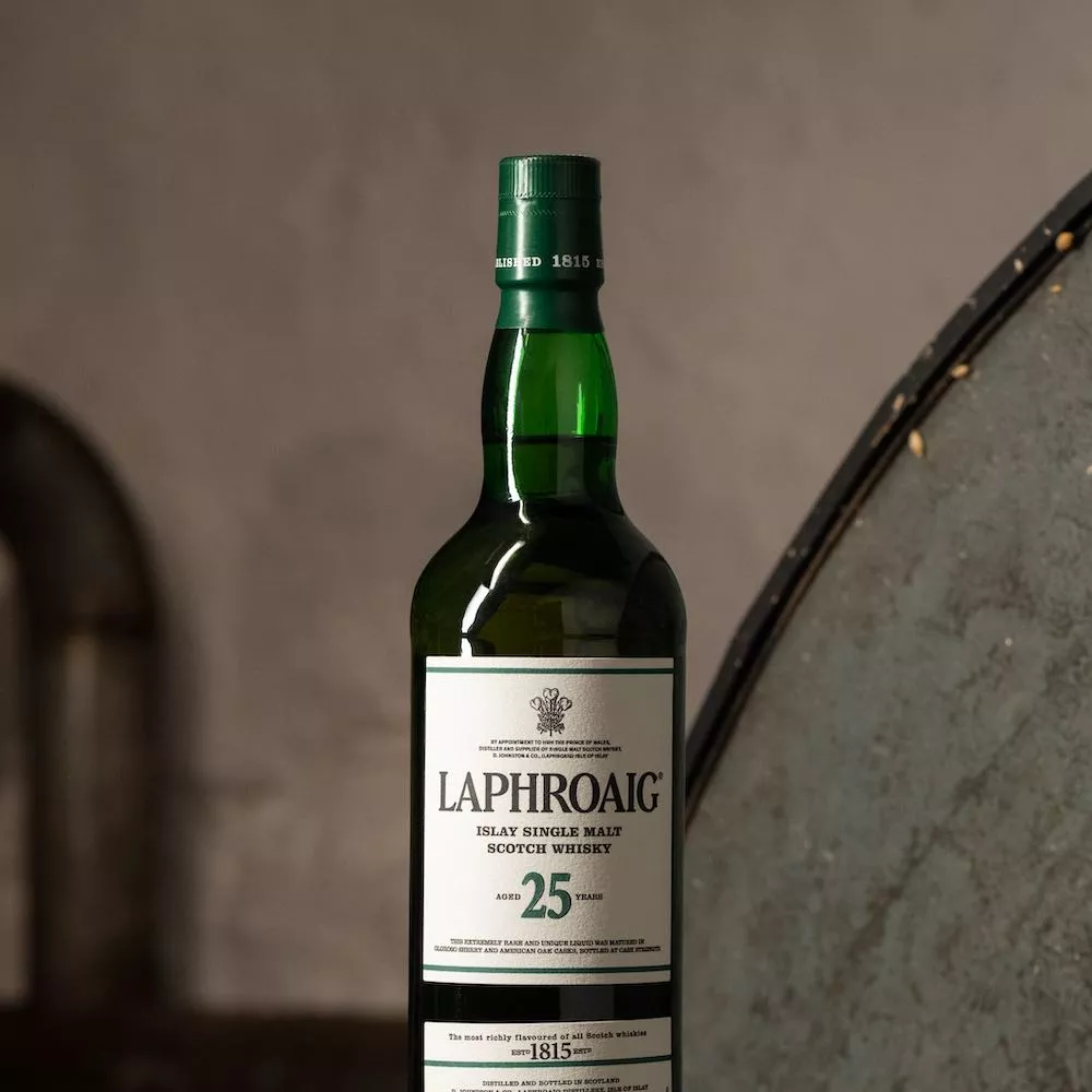 Laphroaig 25 year old single malt whisky against softened stone background