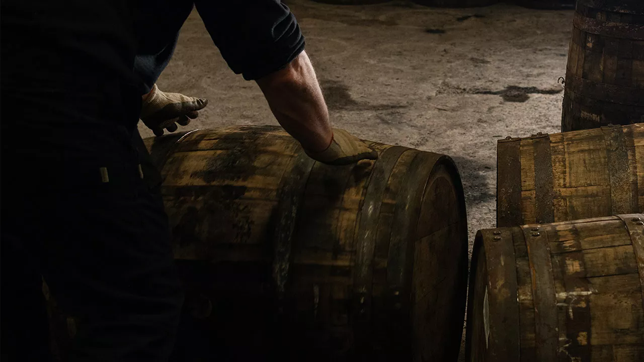 Laphroaig distiller wares tour barrels rolling