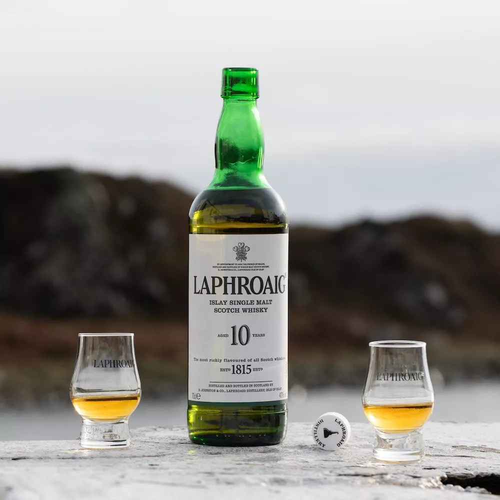 A bottle of Laphroaig whisky and two drams