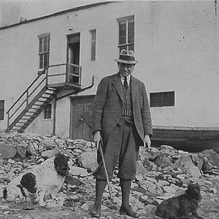 Ian hunter standing in front of the Laphroaig distillery