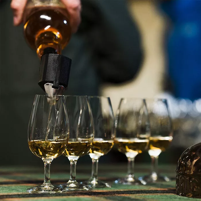 Laphroaig whisky poured into tasting glass