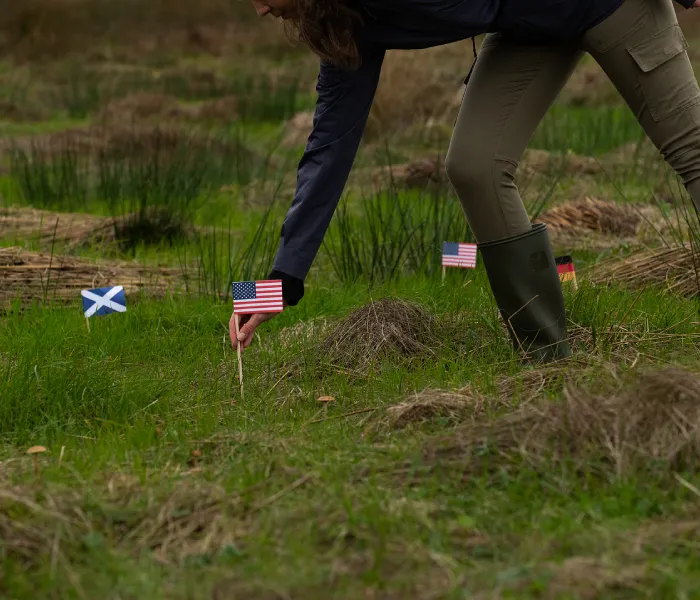 planting a flag at friends of Laphroaig plot