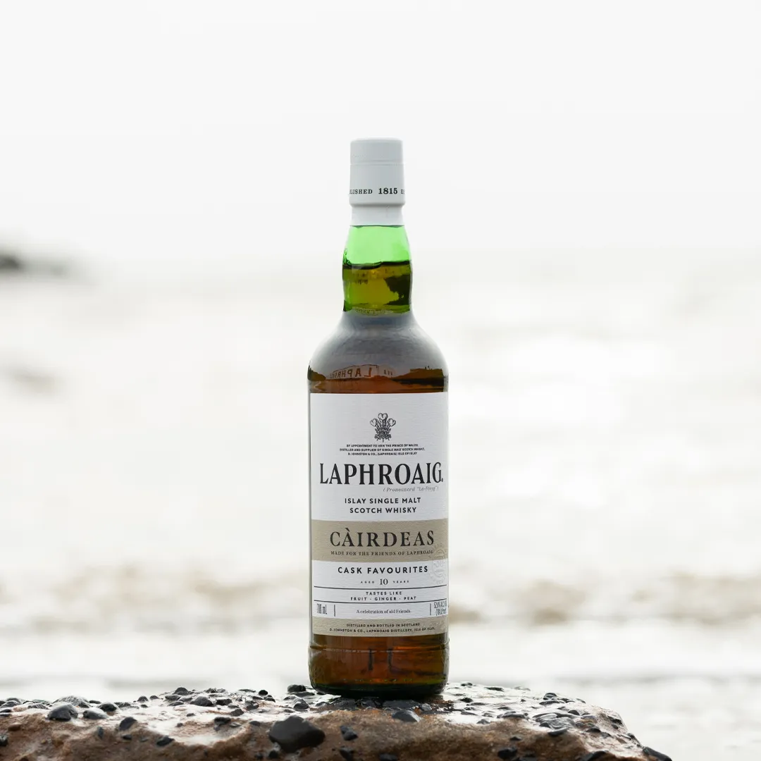 Friends of Laphroaig Cairdeas 2024 Cask Favourites Scotch Whisky Bottle on the Islay shore