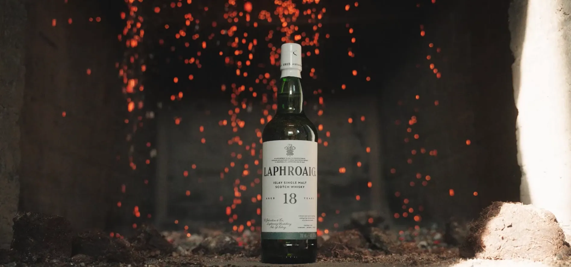 18 Year Old bottle of Laphroaig in the kilns with embers at the distillery
