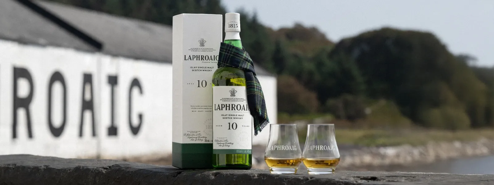 Laphroaig 10 Year old bottle on Laphroaig wall at Distillery